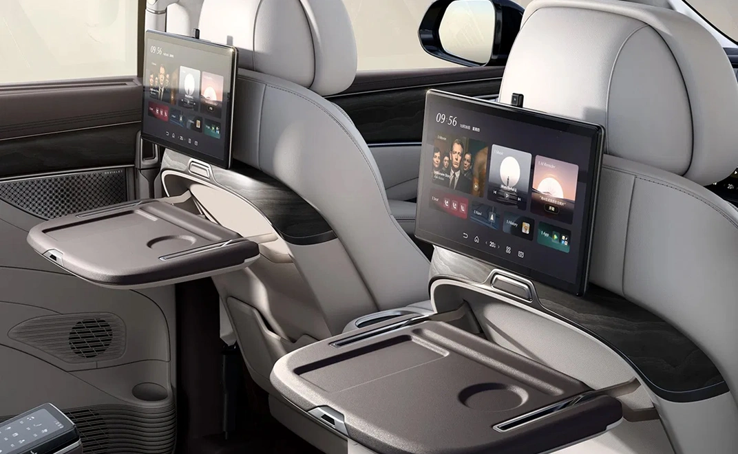 denza-d9-interior-mid-row-screens-retractable-tables